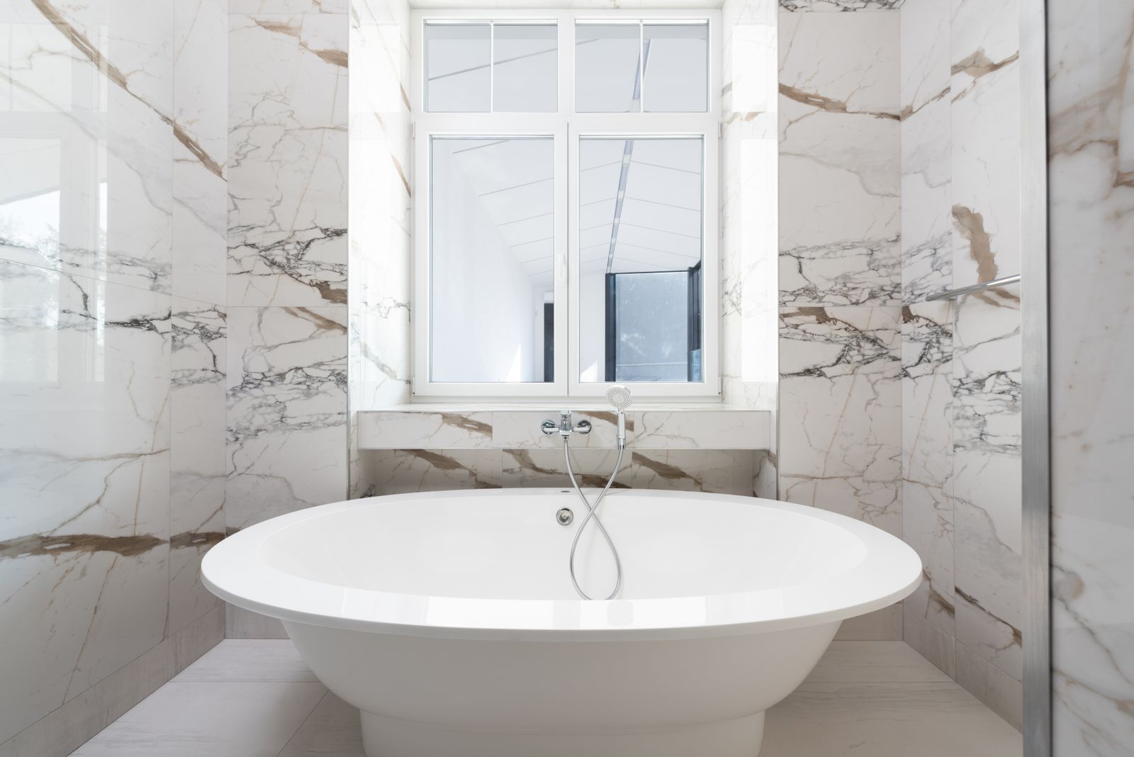 Primary bathroom with a tiled walk-in shower